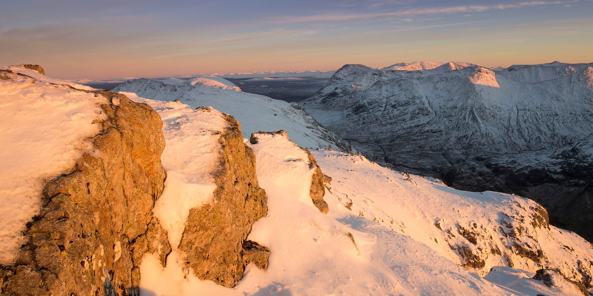 View looking south east from Am Bodach towards Stob nan Cabar and Buachaille Etive Beag in winter, Glen Coe, Lochaber, Scotland.